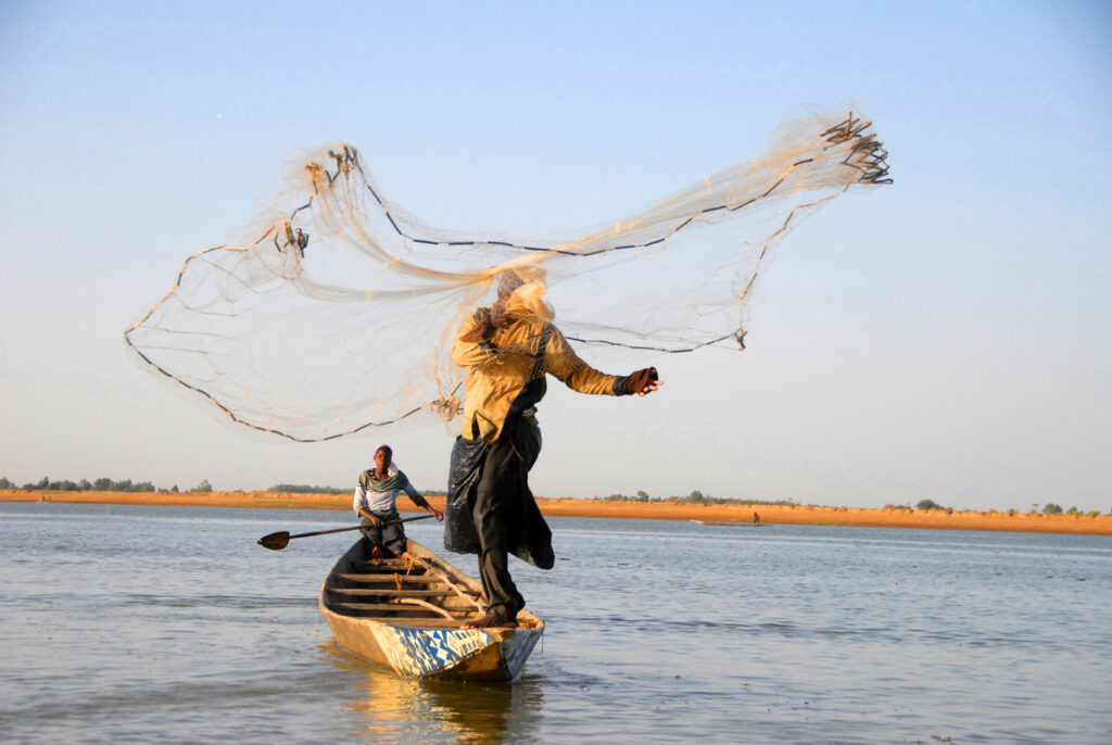 Photo by MASSIMO RINVERSI, The Casting Net, Lac Debo, Mali